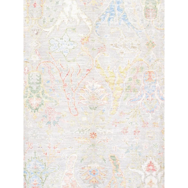 Expertly hand-knotted from fine wool, this Turkish Oushak rug showcases the collection's signature large-scale semi-...