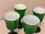 This is a beautiful set of four vintage mid-century modern hand-blown wine glasses featuring vibrant emerald green glass...