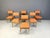 Set of 6 mid century italian dining chairs with wooden frames and new salmon coloured fabric upholstery. Elegant mid...