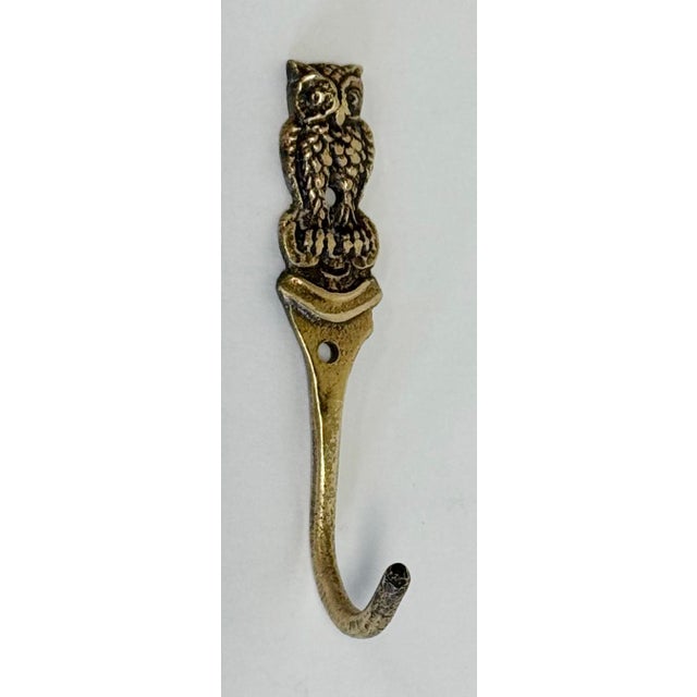 Whimsical petite brass wall hook with detailed owl at top of hook. Patina.
