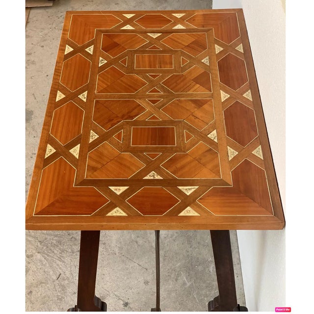 About 19th century Baroque Spanish side table with marquetry top 19th century Spanish trestle table in walnut. This piece...