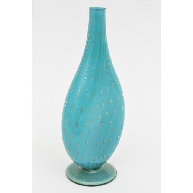 This beautiful vintage Murano hand blown bottle is a luscious color of turquoise with lots of gold aventurine droplets...