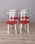 Set of four chairs in white lacquered wood with red vinyl seat, Italian design, 1980s.