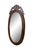Antique Victorian oval vanity / dresser mirror featuring a mahogany frame with carved pierced / reticulated crest...