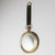 Decorative wall mirror in the form of an oversized pocket watch, im the style of Piero Fornasetti. The profiled brass...