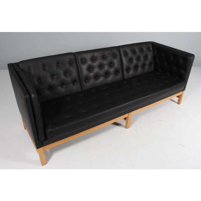Erik Jørgensen Three-Seat New Upholstered with Black Anilin Leather. Frame of Oak. Model EJ 315/3, Made by Erik Jørgensen....