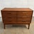 This Danish teak low dresser has a clean, practical form with the warmth and detail that makes mid-century Scandinavian...