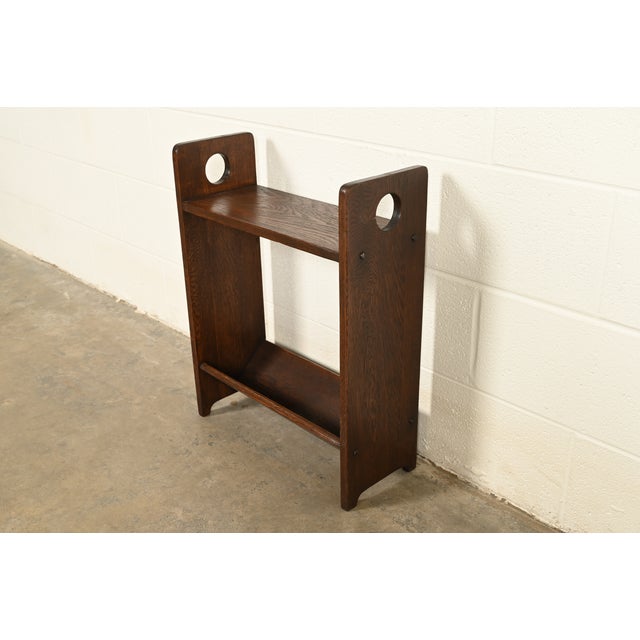 A gorgeous antique Mission or Arts & Crafts period oak bookcase, book trough, or magazine stand In the manner of Charles...