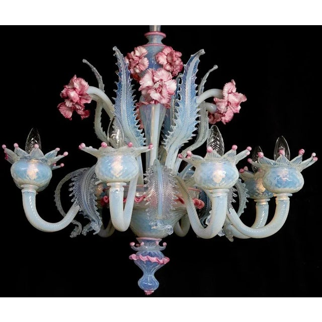 Murano chandelier of awesome beauty. Lights (8) flowers and leaves in pure Murano glass paste. Each piece is a jewel. Up...