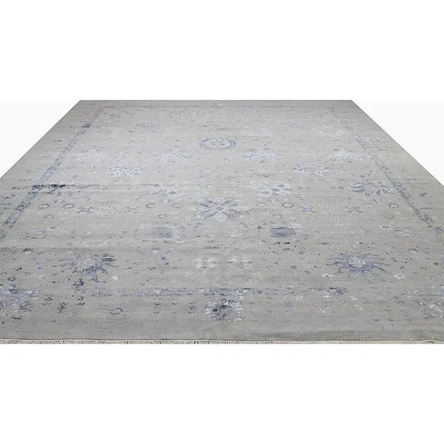 Modern Handwoven Artisan Style Area Rug featuring an allover design in a blue pattern on a light gray-colored background....