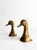 A pair of decorative figures shaped like duck heads, crafted from solid brass. Produced in Spain by Bronces Almazán during...