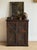 A late 17th-century English oak cupboard dated 1685, carved with the initials “C R” for Charles Regina, marking the reign...