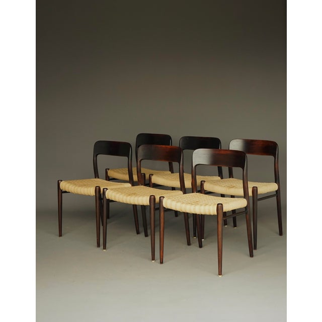 A nice set of 6 dining chairs ‘model 75’ designed by Niels Otto Moller and produced by J.L. Moller in Denmark during the...