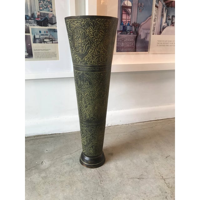 Fantastic conical-shaped metal incised vessel or vase. The repeated patterns are delineated by horizontal incisions and...
