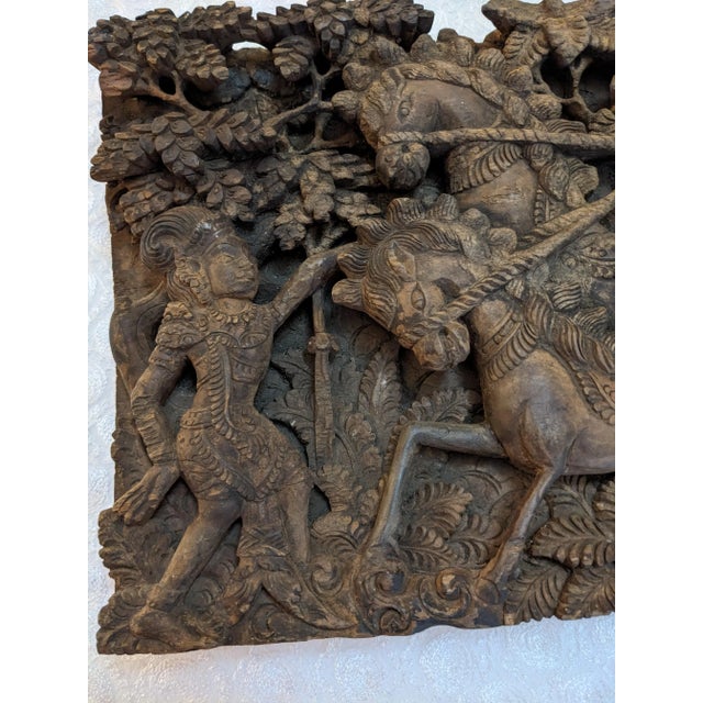 An elaborately detailed wooden carving depicting a scene from the Ramayana (or Mahabharata?). I found the carving in...