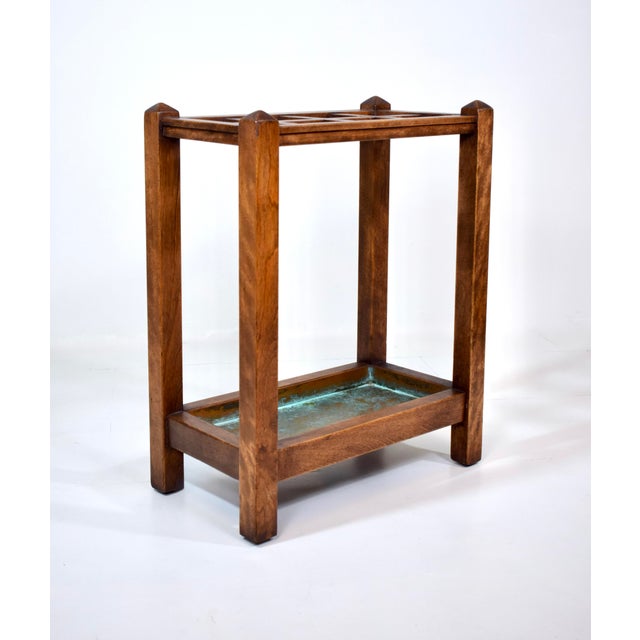 Antique early 20th Century Arts & Crafts Mission Oak umbrella/cane stand with eight sections & original copper liner....