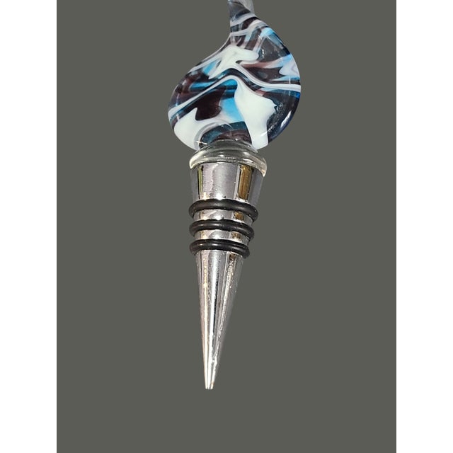 Elevate your wine preservation with this Vintage Art Glass Abstract Design Wine Bottle Stopper. Crafted from premium glass...