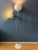 White mid century space age eyeball floor lamp with a small and large shade. The small metal shade on the side can be...