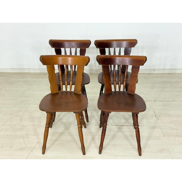 Four beautiful vintage wooden chairs in a classic country style. The chairs are very sturdy, having been built to robust,...