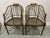 A pair of Baker Furniture faux bamboo wood chairs with can seating . You will receive two chairs, each measuring 35” h x...