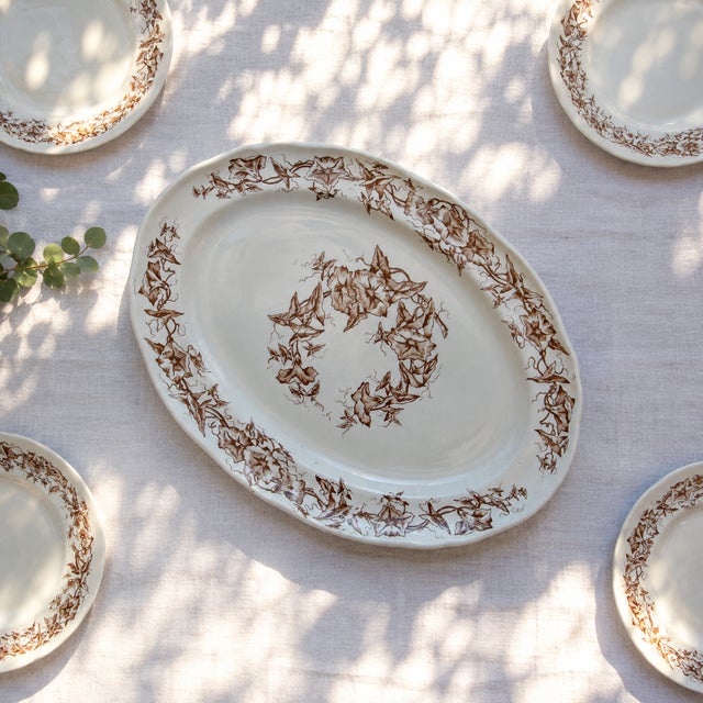 Elegant oval ironstone serving platter signed Longchamp, Liserons collection, late 19th century, circa 1890, sepia-toned....