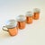 A lovely set of 4 vintage mugs. Each is made of white ceramic with a copper and brass holder. Perfect for everyday coffee...