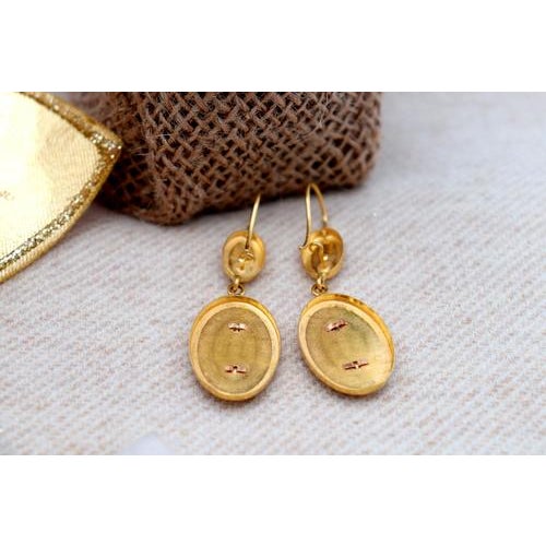 Gold earrings with applications and reliefs, inlaid with synthetic blue stones. Metal: Gold. Origin: Portuguese. Brand:...