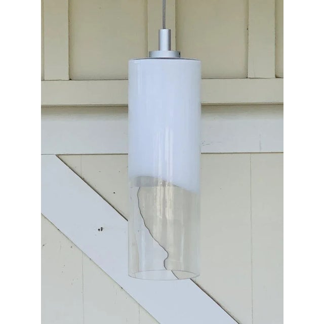 Murano style cylinder shaped opalescent flashed hand blown glass with irregular pattern. Comes with silver cord and...