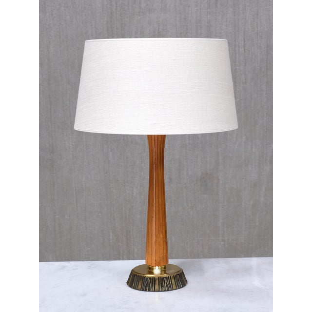 This rare pair of table lamps was designed by bo råman and produced by asea in sweden in the 1950s. Each lamp is engraved...