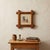 Vintage 1982 hand-worked cross stitch featuring an old-fashioned rocking chair and butter churn, signed “AG 1982.” Worked...