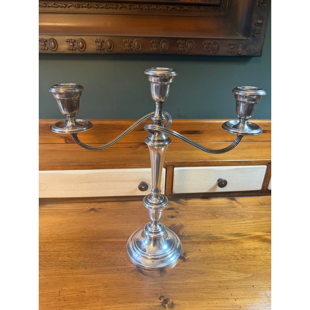 An exceptional and rare pair of vintage triple-light candelabras by the renowned Gorham Silver Co. in the highly sought-...
