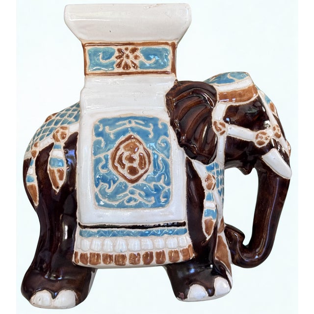 Here is a fancy elephant plant stand with plenty of character! Classic browns and robin's egg blue, strong enough to...