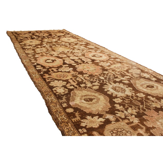 Originating from Russia in 1910, this antique Karabagh runner hosts an uncommonly fine single border, emphasizing a...