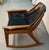 Striking mid-century modern rocking chair Attributed to Jerry Johnson, featuring a sculptural bentwood walnut frame paired...