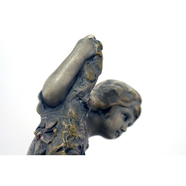 Terracotta figural group with original faceted mirror from the Austrian manufacturer Goldscheider around 1898/1900 This...