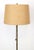 Mid Century style table floor lamp made of a brass stem, aluminum base, travertine table tray, and a burlap shade. It is...