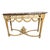 An elegant carved pine console table topped with a richly veined marble slab, executed in the Louis XVI taste. The...