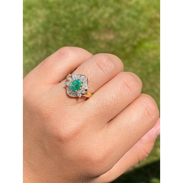 The Sunset Ridge: Natural Emerald and Diamond Cocktail Ring. The ring centers on a natural oval brilliant cut 0.75 carat...