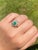 The Sunset Ridge: Natural Emerald and Diamond Cocktail Ring. The ring centers on a natural oval brilliant cut 0.75 carat...