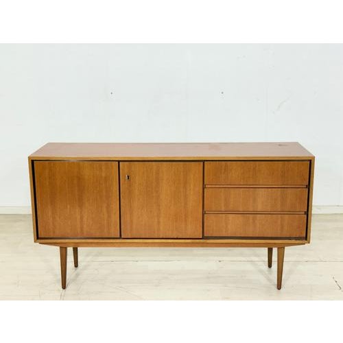 Beautiful vintage sideboard from the 1960s. This piece of furniture impresses with its clean lines, elegant proportions,...