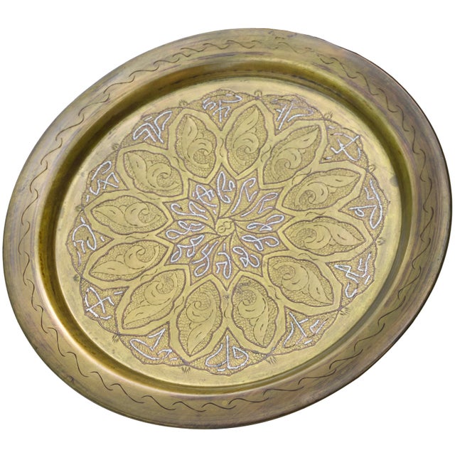 One-of-a-kind antique highly crafted and detailed Moroccan solid brass tray. Featuring an elaborate hand-engraved motif in...