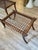 Stool with saber-shaped legs made of polished wood and a woven leather seat. Other finishes and upholstery options are...