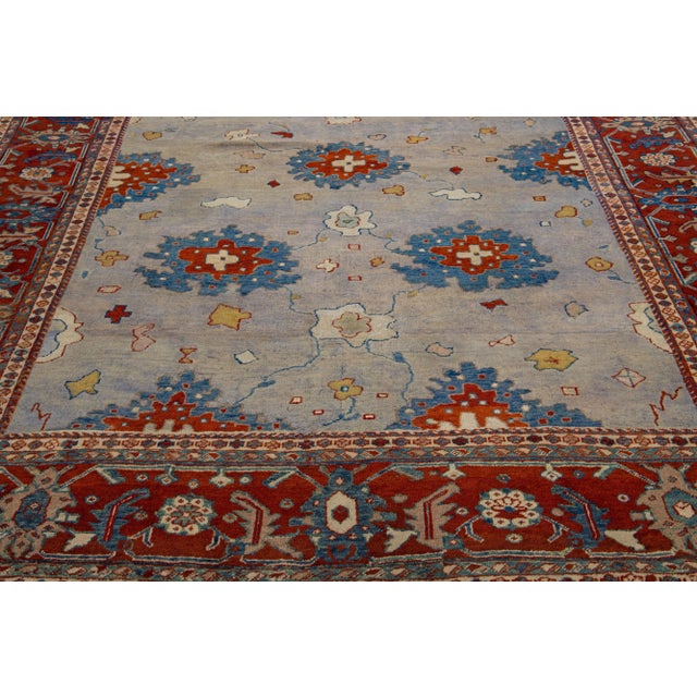 This antique Persian wool rug has exquisite craftsmanship and intricate hand-knotted mahal design. The gray color field...