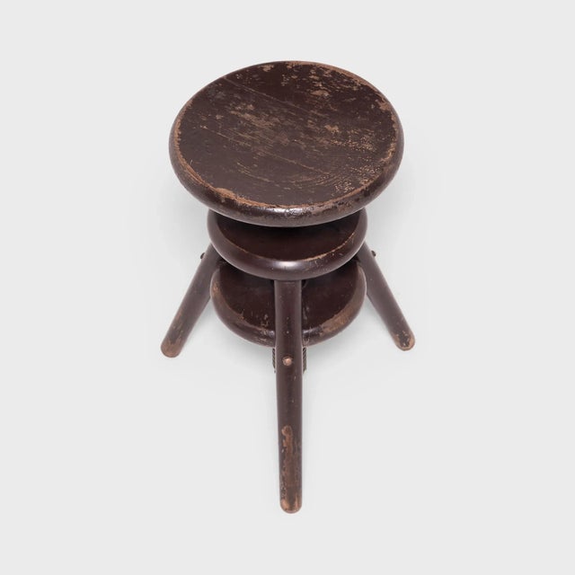 It is unusual to see an early 20th-century Chinese round stool designed to be adjustable. The artisan who created this...
