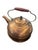 Copper tea kettle from mid-20th century made in Rome, NY by Revere Ware. Brass and wooden accents on handle and lid....