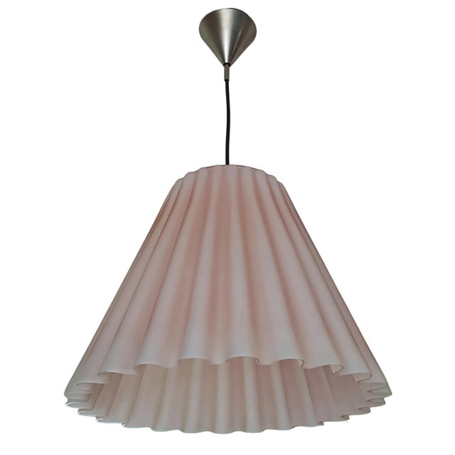 A beautiful impeccable pale pink Murano glass pendant light with a scalloped or pleated detail. You could easily swap out...