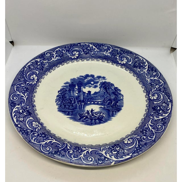 English Chop Plate by Ridgways (Ridgway) in the “Rhine” pattern of blue on white Transferware. The Maker’s Mark is on the...