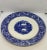 English Chop Plate by Ridgways (Ridgway) in the “Rhine” pattern of blue on white Transferware. The Maker’s Mark is on the...