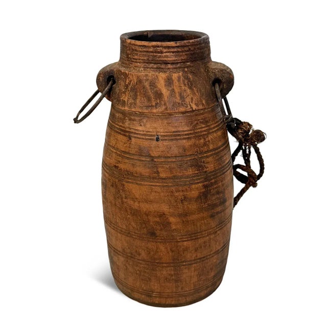 Vintage wooden pot with iron ring and rope carrying handle originally used for carrying water. Wonderful piece with...