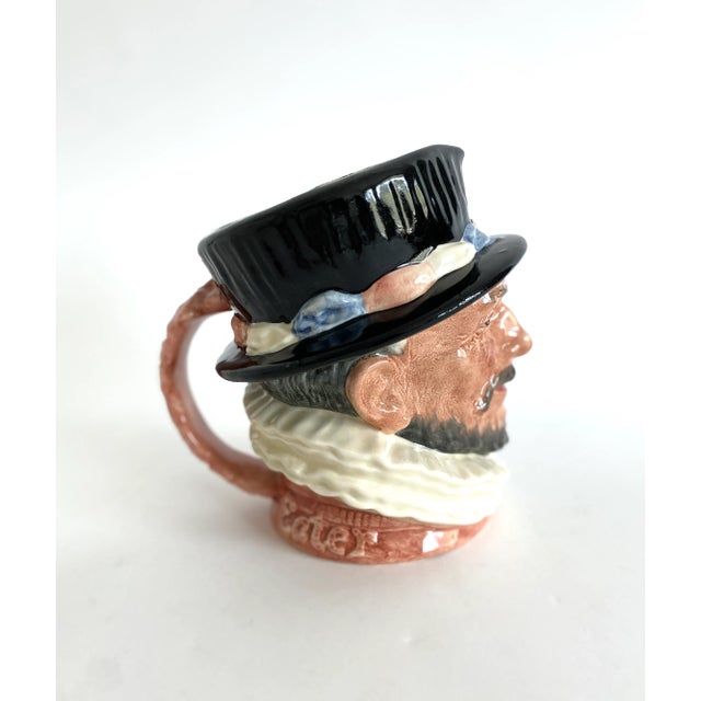 This classic English porcelain character toby mug of the Beefeater, dated 1946 on the underside, was hand-painted with the...